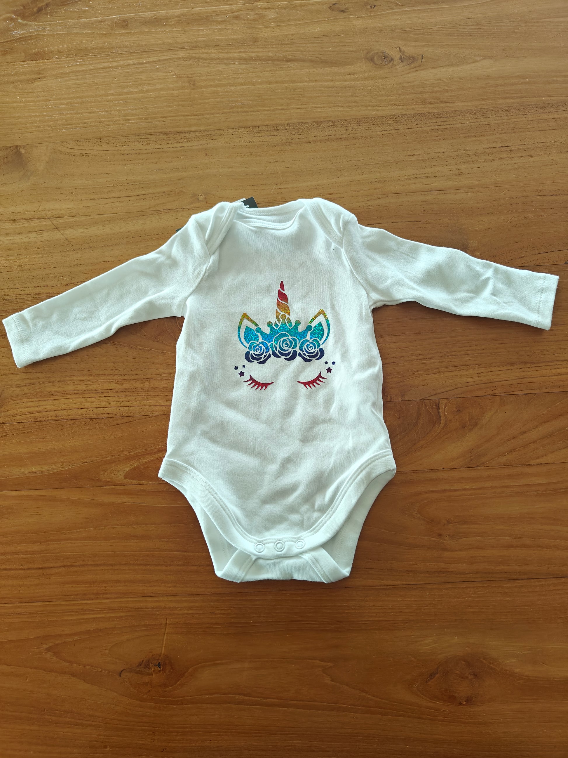 Rompertje met unicorn maat 62